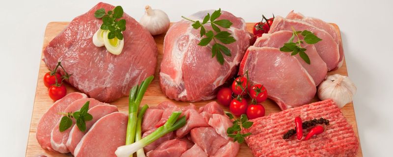 Pork chops, roasts and ground pork on a cutting board